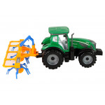 Zelený traktor s hrabľami na seno – trecí pohon